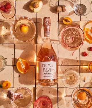 Prima Pave Rose Brut with fruit and glasses